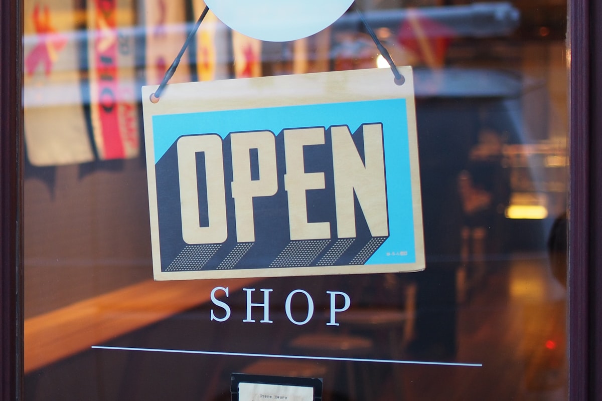 Shop owner tracking customer loyalty and repeat visit metrics